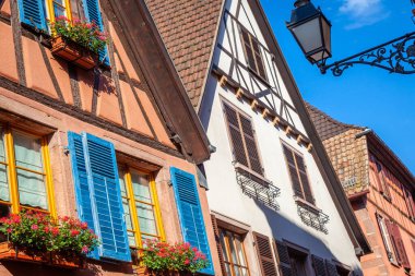 Riquewihr beautiful alsatian architecture at springtime with flowers, Eastern France