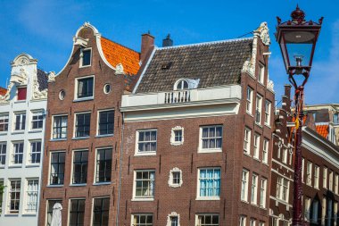 Amsterdam buildings and dutch architecture at sunrise, Netherlands