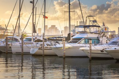 Miami sea habor at golden sunset with american flag, Florida, United States