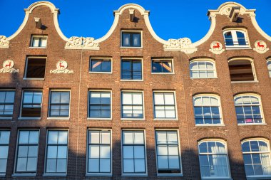 Amsterdam buildings and dutch architecture at sunrise, Netherlands