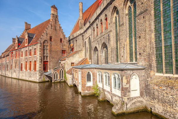 Traditional flemish architecture with Canal Houses of Bruges at clear sky, Belgium