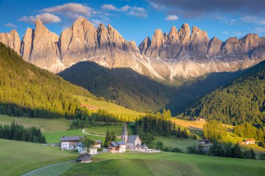 St. Magdalena village with famous church in Val di Funes at sunset, Dolomites , Italy