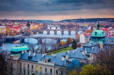 Above Prague old town bridges and river Vltava at dramatic dawn, Czech Republic