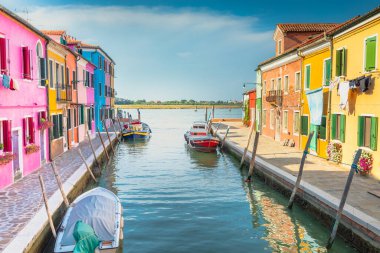 Burano island canal, colorful houses and boats, Venetian lagoon, Northern Italy