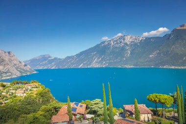 Idyllic lake Garda coastline in Malcesine in Limone sul Garda and mountains, Northern Italy