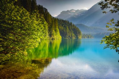 Idyllic Lake Tovel reflection symmetry in Trentino-Alto Adige, Italy