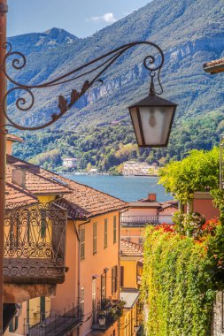 Colorful old town street with springtime balcony in Bellagio, Northern Italy
