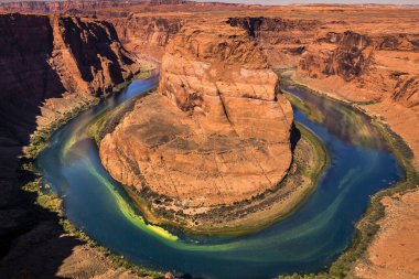 Horseshoe Bend above emerald Colorado River at sunset, Page, Arizona, United States