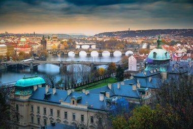 Above Prague old town bridges and river Vltava at dramatic dawn, Czech Republic