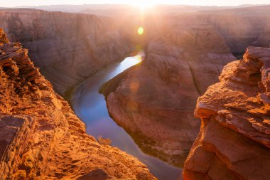 Horseshoe Bend above emerald Colorado River at sunset, Page, Arizona, United States