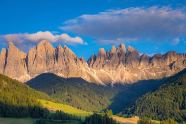 St. Magdalena in Funes valley with pinnacles at dramatic sunset, Dolomites , Italy