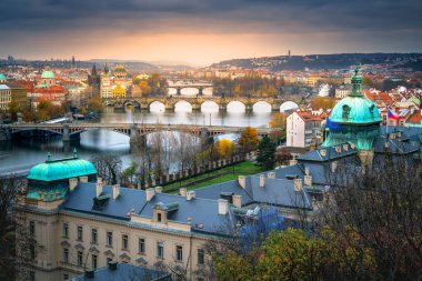 Above Prague old town bridges and river Vltava at dramatic dawn, Czech Republic