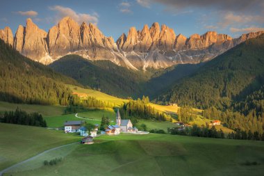 St. Magdalena village with famous church in Val di Funes at sunset, Dolomites , Italy