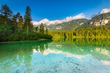 Idyllic Lake Tovel reflection symmetry in Trentino-Alto Adige, Italy