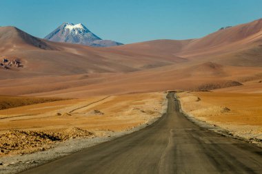 Country road in Atacama desert, volcanic arid landscape in Northern Chile border with Bolivia, South America