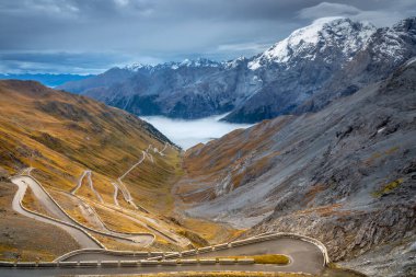 Stelvio mountain pass, dramatic road in italian alps, Italy, border with Switzerland clipart