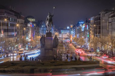 Wenceslas Square cityscape at night with blurred traffic movement, Prague, Czech Republic