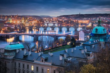 Above Prague old town bridges and river Vltava at dramatic dawn, Czech Republic