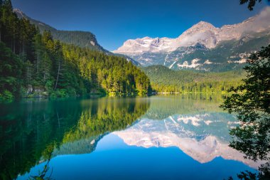 Idyllic Lake Tovel reflection symmetry in Trentino-Alto Adige, Italy