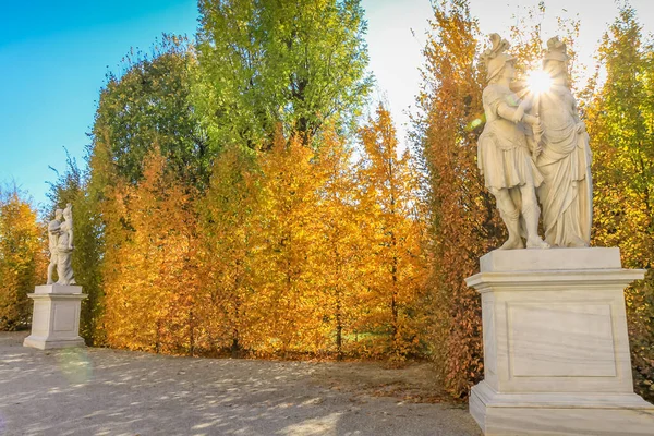 Golden autumn sunset with full moon in Vienna public park , Austria, Europe