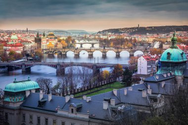 Above Prague old town bridges and river Vltava at dramatic dawn, Czech Republic