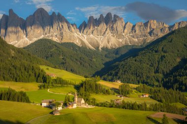 St. Magdalena village with famous church in Val di Funes at sunset, Dolomites , Italy