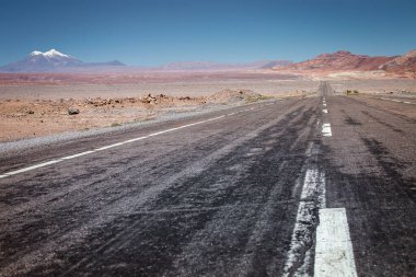 Country road in Atacama desert, volcanic arid landscape in Northern Chile border with Bolivia, South America