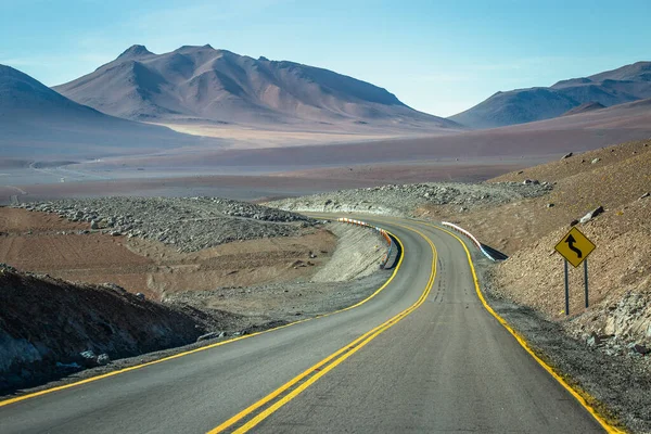 Country road in Atacama desert, volcanic arid landscape in Northern Chile border with Bolivia, South America