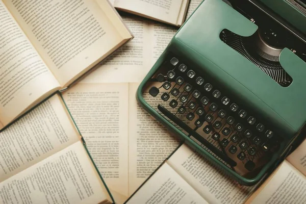 Top View of Vintage Typewriter with Books and Copy Space