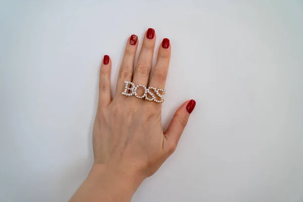 Close Female Hand Palm Red Manicure Ring Boss — Fotografia de Stock