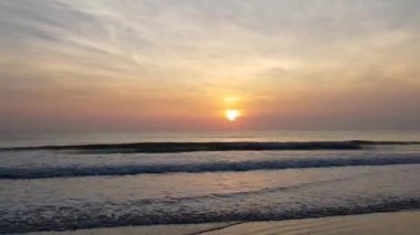 beautiful sunrise over the sea, morning at the beach near waves. Huahin Thailand.