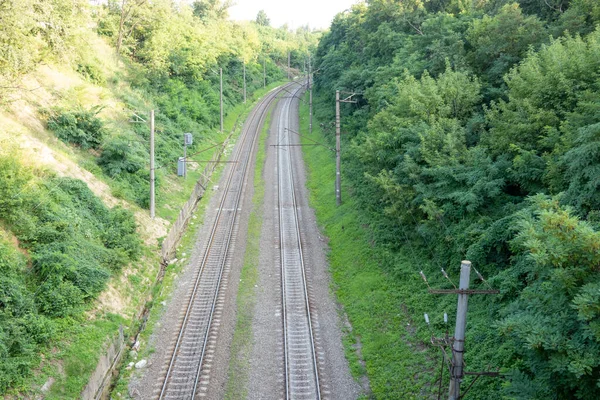 railway tracks on the road, view from above on the railway road, travelling, direction of way
