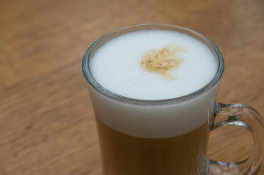 close up of white frothy foam in the cup of latte. Softness of drink. Breakfast time in cafe 