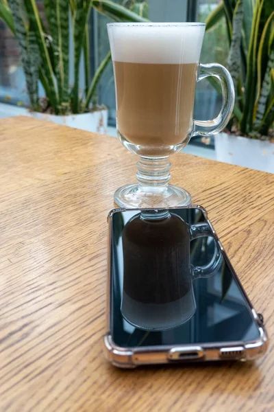 Latte Foam Transparent Glass Wooden Table Cafeteria Plants Indoors Silhouette — Zdjęcie stockowe