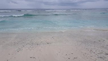soft waves at the beautiful beach with blue turquoise water and clear sky, Maldives
