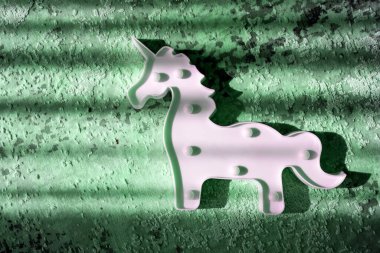 creative light effect, sunbeam stripes on green background, white unicorn toy lamp, children toys