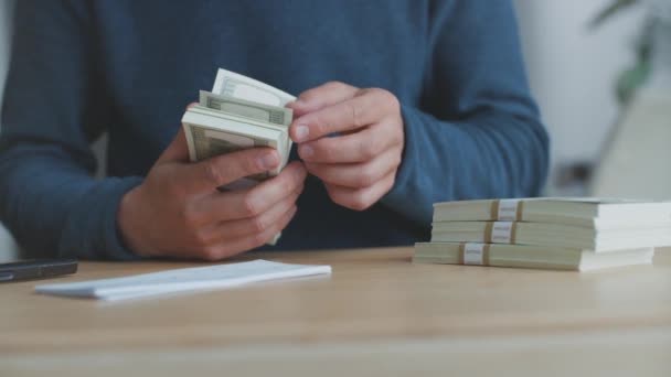 Man Counts Money Unrecognizable Young Man Calculating Cash Dollars Indoors — Vídeo de stock