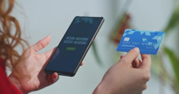 Close Cropped View Young Woman Holding Credit Card Mobile Phone — Stock Video