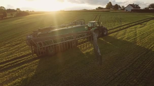 Tractor Pulling Large Barrel Water Twenty Meter Watering Pipes Spraying — Stock Video