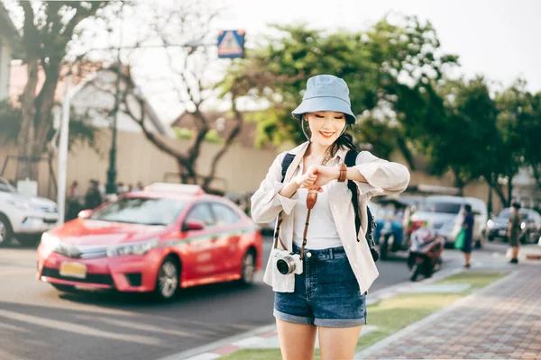 Walking Happy Young Adult Asian Woman Traveller Using Smart Watch — Stok fotoğraf