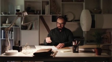 Man that works at night. Exam preparation. Scandinavian design. 