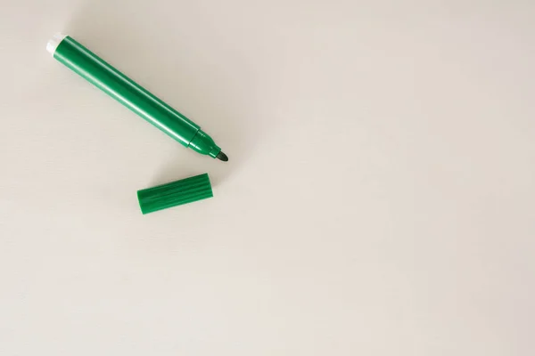 Green felt tip pen on white background