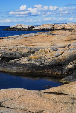 A beautiful view of the rocky coastline of a place called 