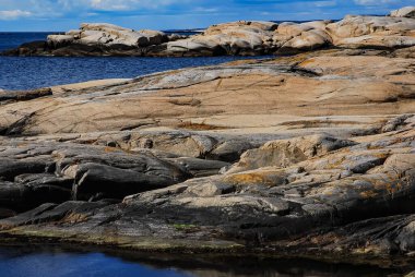A beautiful view of the rocky coastline of a place called 