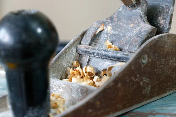 old rusty metal grinder with a hammer