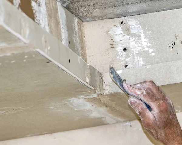 worker with a brush in the wall