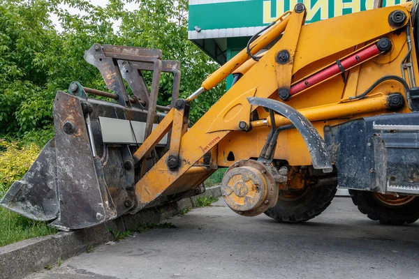 excavator change wheel at tire service without front wheel