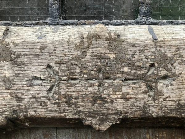 old wooden wall with a large pattern of the wood