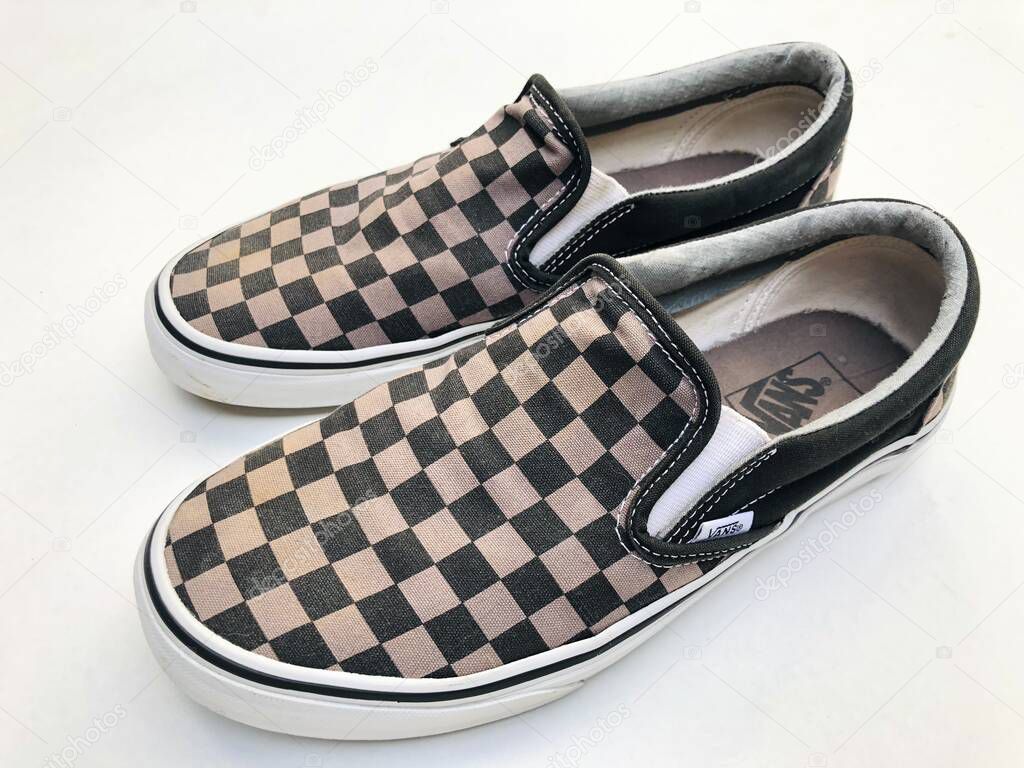 Malang, Indonesia - May 13th 2022: Vans Slip on Checkerboard shoe series on a white background