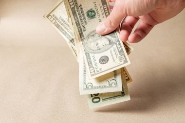 Dollar banks note money in the hand . Passive Income Concept - Residual Income